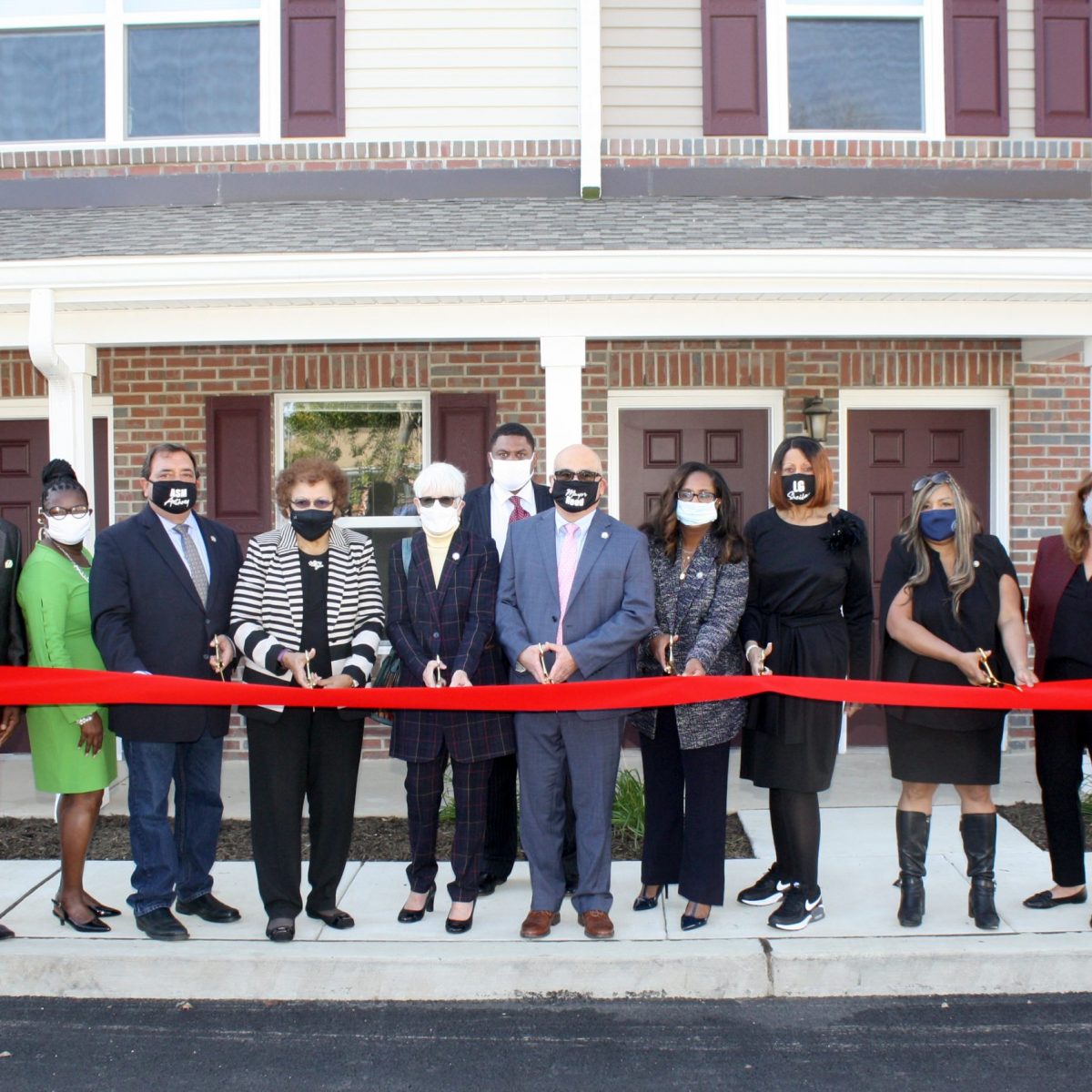 Cutting the ribbon on Thursday, Oct. 15, 2020 to mark the completion of downtown Trenton’s newest affordable housing community, Turner Pointe, were (l. to r.) THA Redevelopment Project Mgr. Chrysti Huff, THA Board Chair Clifton Anderson, THA Commissioner Darlene Weldon, NJ Assemblyman Anthony Verrelli, NJ St. Sen. Shirley Turner (the namesake of Turner Pointe), Trenton City Councilwoman Marge-Caldwell Wilson, THA Exec. Dir. Jelani Garrett, Trenton Mayor Reed Gusciora, NJ Assemblywoman Verlina Reynolds-Jackson, NJ Lieutenant Governor Sheila Oliver, HUD Regional Administrator Lynne Patton, TD Bank VP Sue Taylor, and Conifer Realty Project Director Janine Owens.